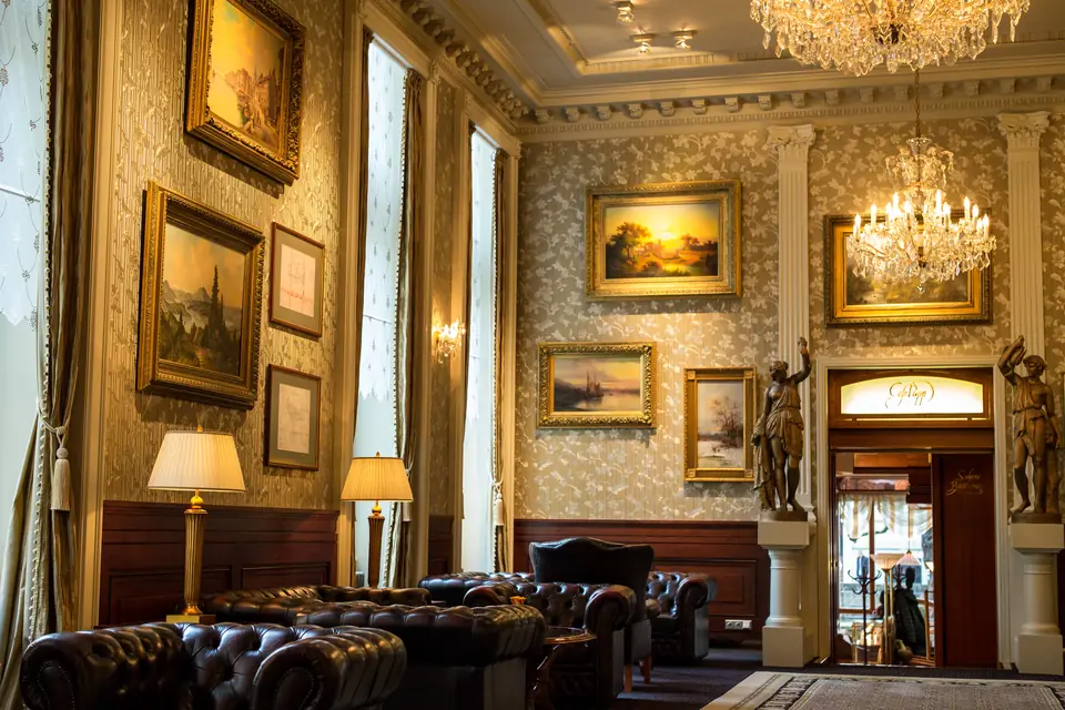 Cigar Etiquette: A Practical Guide for Malaysia — classic grand lounge with leather chesterfield sofas, gilt-framed paintings and chandelier